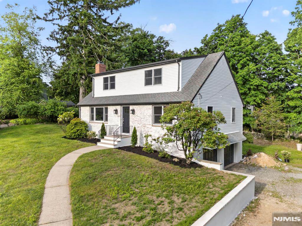 Beautifully renovated 5 bedroom, 3 full bath home located in one of Mahwah's most sought-after neighborhoods. This spacious residence seamlessly blends modern updates with timeless character, featuring an open concept layout, gleaming hardwood floors, and a cozy wood burning fireplace. A substantial second floor addition has significantly expanded the home's living space, offering three generously sized bedrooms, including a large full bath and stunning primary suite. Much larger than it appears from the exterior, this home offers an impressive layout and square footage that must be seen to be appreciated. Buyers are encouraged to perform their own due diligence regarding square footage, as tax records may not reflect the home's expanded living area. The finished basement with sleek tile flooring provides additional flexible space, perfect for recreation, a home office, or gym. Enjoy the convenience of a two-car garage, expansive driveway, brand-new mini-split systems, central air, and a new well water system. The freshly painted exterior enhances the home's curb appeal, while its prime location offers easy access to NYC transportation, major highways, shopping, dining, and outdoor recreation. A truly move in ready opportunity in Mahwah. Driveway BLACKTOP WILL BE COMPLETED AT CLOSING!