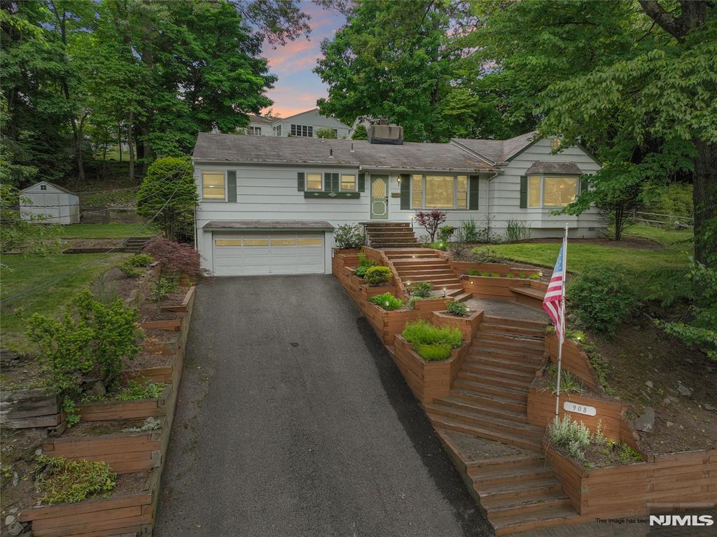 Beautifully maintained 3-bedroom, 2.5-bath ranch set high on a lovely property with a nice, flat backyard. The renovated kitchen and breakfast room offer stylish updates including stainless appliances, skylight, built-ins with custom lighting, and an inviting everyday living space. A spacious great room with fireplace is perfect for relaxing or entertaining, while the living room and dining room are enhanced by a striking two-sided fireplace. The primary bedroom includes a private half bath, while two additional bedrooms share a full hall bath. The finished lower level offers flexible living space including an office/den, full bath, laundry room, storage closet, and access to the attached 2-car garage. Current owner has lived in the property for 30 years...bring your ideas to make this home your own! Additional highlights include a brand-new boiler installed in June 2026 and an upcoming landscaping project in rear yard scheduled for June that will further enhance the propertyâ€™s appeal. Conveniently located close to shopping, parks, and NJ Transit train service.