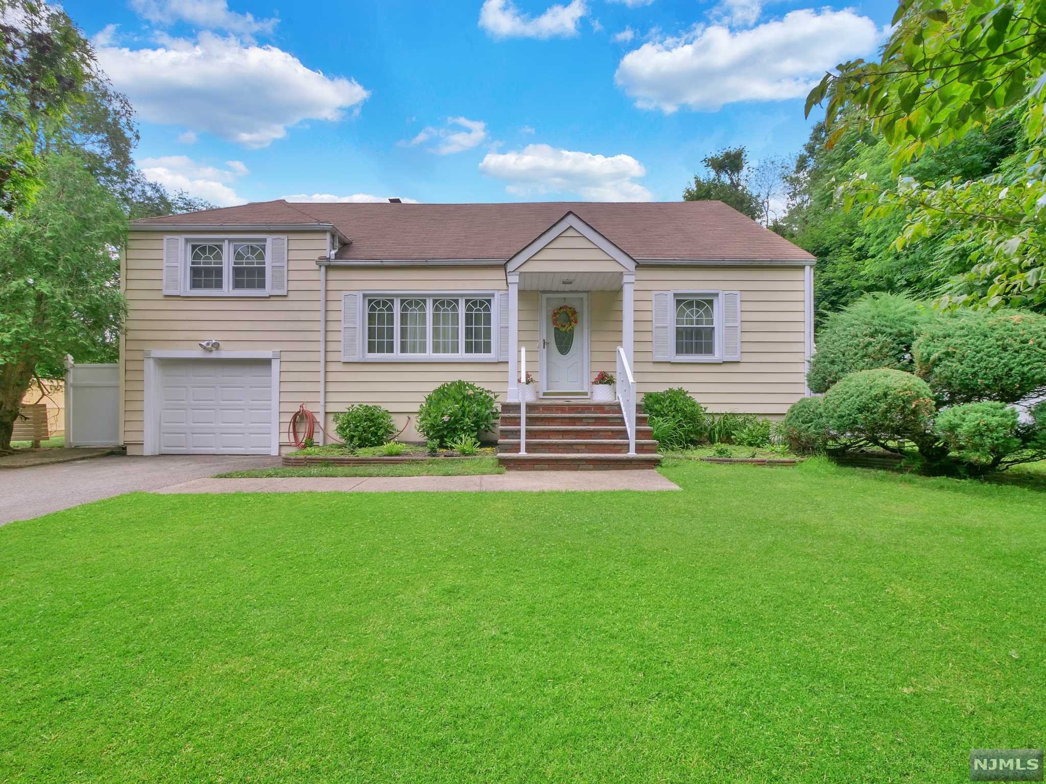 Well-maintained Split-Level home in convenient location of Wayne! Enter into the main living area where you will find the formal living room with fireplace and family room. The formal dining room is located just off of the living room and features some storage for serving wear and dining storage. Gleaming hardwood floors run throughout the entire main floor. Formal dining room leads to tastefully updated kitchen, which offers custom cabinetry, center island with barstool seating, stainless steel appliances, granite countertops and separate dining area. Large windows in the kitchen give off great natural light. Storage will not be an issue in this kitchen. Sliders lead out to rear deck. First floor is complete with guest bedroom and full bathroom that offers tub shower with sliding glass enclosure and storage vanity. Retreat upstairs to find the large primary bedroom with sizable closet and sitting area. There is also an additional bedroom and full bathroom.