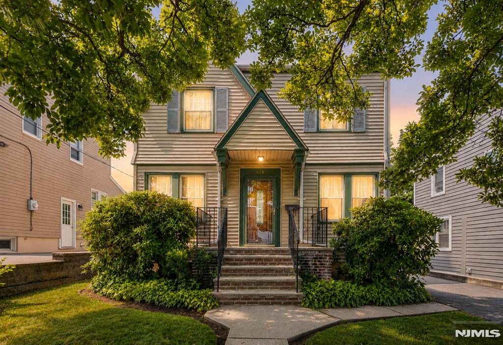 Welcome to this charming 3 bedroom, 2 full bath Colonial nestled on a quiet residential street in desirable Wood Ridge. This well-maintained home showcases timeless character with beautiful hardwood floors, original wood trim, graceful arched doorways, and abundant natural light throughout. The inviting living room features a decorative brick fireplace and flows seamlessly into the formal dining room, creating an ideal layout for everyday living and entertaining. The kitchen offers ample cabinet space and overlooks the backyard with convenient access to the rear of the home. The second floor offers three comfortable bedrooms and a full bath, while the walk-up attic provides exceptional storage or future expansion potential. The finished basement includes a spacious recreation area, and additional storage space, offering endless possibilities for a home office, gym, or playroom. Outside, enjoy a detached garage and private backyard ready for gardening, entertaining, or relaxing. Conveniently located near parks, shopping, restaurants, schools, major highways, and NJ Transit with easy access to New York City. A wonderful opportunity to make this classic Wood Ridge home your own.