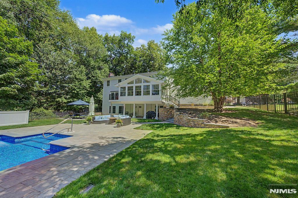 ESCAPE TO YOUR OWN PRIVATE OASIS This exceptional 4-bedroom, 3.5-bath Center Hall Colonial blends timeless elegance, modern upgrades, breathtaking views, & resort-style outdoor living. As the last home on the street, enjoy spectacular sunset views overlooking Van Gelderâ€™s Pond. Hardie Board siding, new roof, some new windows & numerous quality improvements enhance both curb appeal & peace of mind. Spacious sun-filled rooms are designed for comfortable living & effortless entertaining. A completely renovated high-end kitchen opens to an inviting family room w/fireplace, while a stunning 4-season glass room offers panoramic backyard & pond views year-round. A luxurious primary suite feat. soaring ceilings & spa-like bath w/soaking tub, walk-in shower, and double vanity. The main hall bath has also been beautifully renovated. A walkout lower level offers flexibility w/separate entrance, covered patio, BR suite, exercise room, fireplace, & additional living space ideal for guests or recreation. Step outside to your private backyard retreat feat. Trex deck with stairs to the yard, an in-ground pool with new liner, expansive paver patios, covered entertaining areas, & custom bar. Whether hosting gatherings or enjoying peaceful sunsets over the water, this outdoor setting is unforgettable. Add'l highlights incl a whole-home generator, 2 year old A/C, 2 fireplaces, 2 h/w heaters (one newer), newer furnace & countless thoughtful upgrades throughout this meticulously maintained home.
