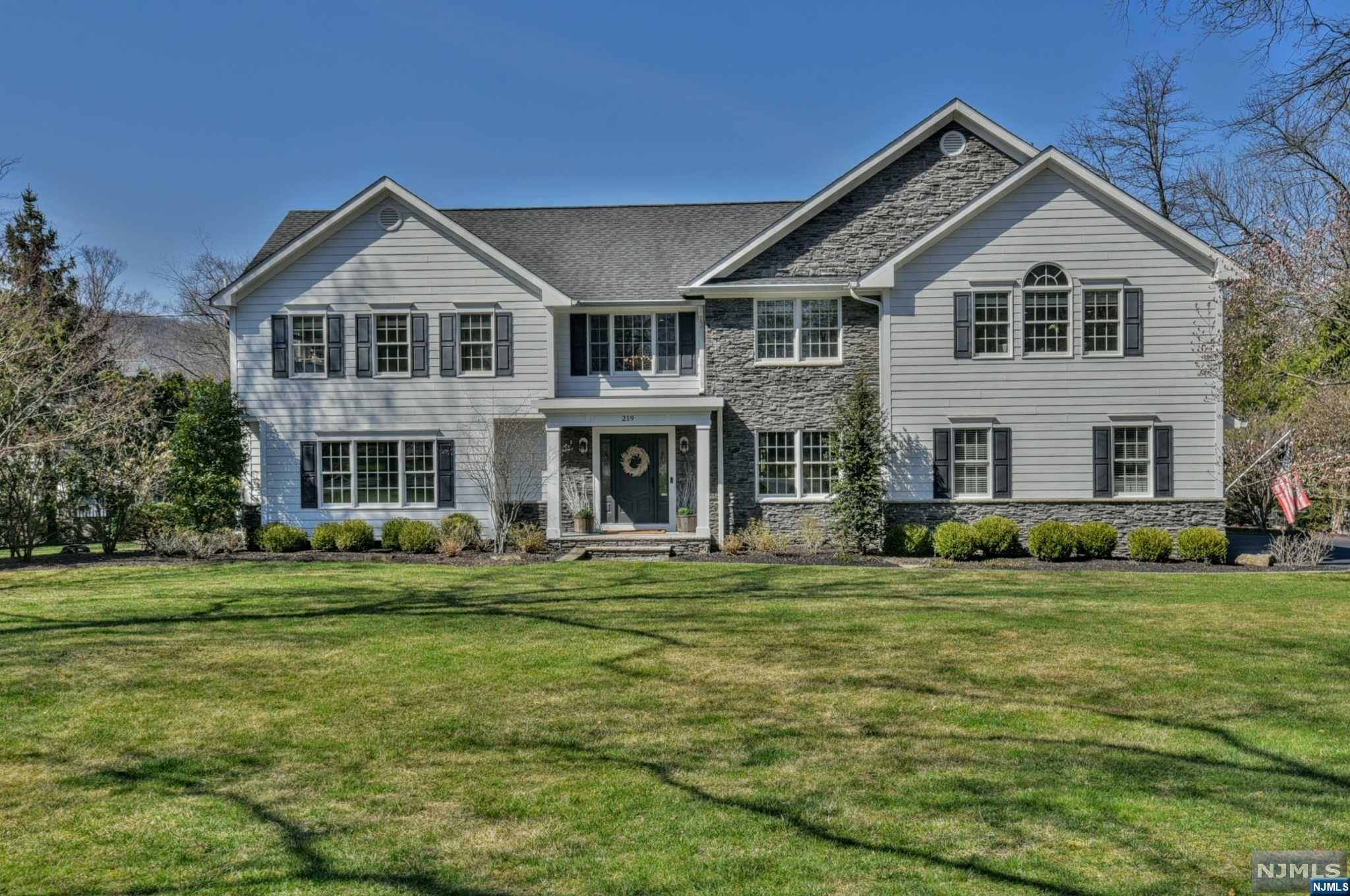 Amazing opportunity to own this beautiful colonial in the Sicomac section of Wyckoff on one of the best streets in town. Walk right in and you will be wowed by the two story entry, inviting LR, banquet sized dining room, gourmet kitchen with high-end appliances, pantry and breakfast room, magnificent great room with stone fireplace - several French Doors lead to the raised bluestone patio that overlooks the backyard, first floor guest suite, powder room, mudroom and the 3 car garage. The 2nd floor has a spa-like Primary Suite w/oversized WIC, sitting room with FPL and a 2021 bath, additionally there is a junior suite, 2 BRs, FBath, + Laundry Rm. The basement has 2 large rec areas, office area, and oversized storage area, wall of closets and a PR. The backyard is flat and lush with professional landscaping. Amenities include hardwood floors, beautiful moldings, modern and updated painting. This home is great for every day living and entertaining a crowd! A must see!