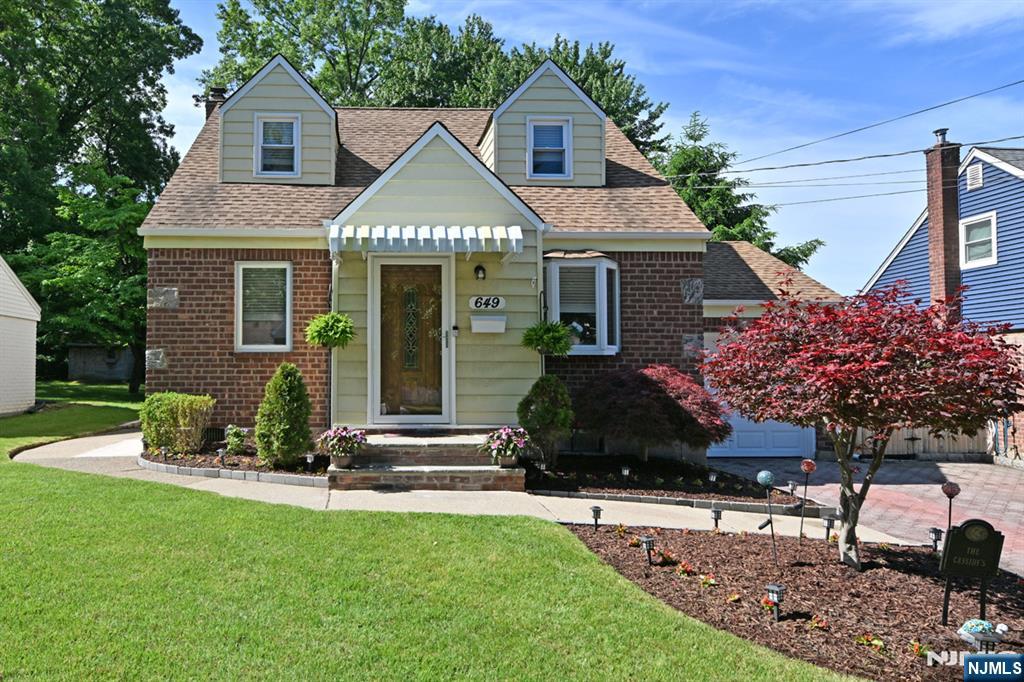 This expanded & tastefully updated 3 bedroom 2 full bath Cape Cod offers the perfect blend of charm, modern updates and exceptional living space. Much larger than it appears, the home features 1,465 square feet plus a finished basement. The entry foyer welcomes you to the Formal Dining room accented with chair molding. The gorgeous, new kitchen features porcelein & glass tiles, SS appliances, quartz counters & a built-in quartz breakfast bar. The spacious 24'x14' Family/Living Room has sliding glass doors to a covered deck. All 3 bedrooms are located on the second level, including a large Primary BR along with the second full bath. The finished basement provides additional livingn space ideal for a family room, home office, gym or media room. along with abundant storage and a convenient, covered walk-out access to the yard Additional highlights include: Anderson windows, a double-width paver driveway, professional landscape, a large storage shed, and a fenced, park-like backyard complete with and a fire pit area-your own private outdoor retreat. Quiet street. Ideally located near downtown, Westwood's charming shops, restaurants, parks, schools & convenient NYC train & bus transportation