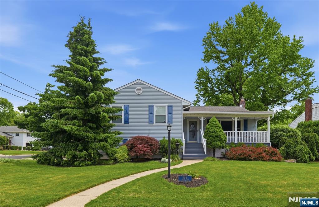 Nestled on a quiet cul-de-sac in sought-after Oradell, this charming split-level home welcomes you with a classic lemonade front porch and exceptional curb appeal. Freshly painted, this well-maintained home offers 3 bedrooms and 2.5 bathrooms. The main level features a spacious living room with high ceilings that seamlessly flows into the dining room, where sliding glass doors open to a deck, creating the perfect indoor-outdoor entertaining space. The eat-in kitchen boasts a bay window overlooking the large, beautifully fenced backyard.Just a few steps up, you'll find the primary suite featuring a brand-new private bathroom, along with two additional bedrooms and a full hall bathroom with a double vanity.The ground level offers a renovated family room, a powder room, direct access to the two-car garage, and sliding doors leading to a spacious patio and backyard.The finished basement provides versatile living space ideal for a recreation room, gym, playroom, or media area. A separate room is perfect for a home office, while the laundry room completes this level. Conveniently located less than a mile from Oradell's highly regarded public schools, just 0.7 miles from the NYC bus stop, and 1.1 miles from the Oradell train station, this home is a commuter's dream while offering the charm and tranquility of one of Bergen County's most desirable communities.