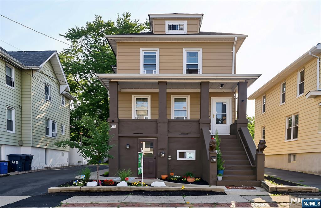 Welcome to this beautifully maintained two-family home in a great neighborhood. The first unit features 4 bedrooms and 1.5 bathrooms. The ground level offers an entry foyer, a bonus room, an updated eat-in kitchen with a dining area, a primary bedroom, a half bath, a utility room, and a laundry room with access to the backyard. The second level includes three additional bedrooms, a bright living room, a full bathroom, and direct access to the backyard. The second unit features a large open front porch, an eat-in kitchen, a comfortable living room, and one bedroom on the main level. The finished attic offers an additional bedroom and a bonus room, providing flexible living space. Additional highlights include a spacious driveway accommodating up to four cars and a private backyard, perfect for outdoor entertaining or relaxing. Conveniently located near parks, schools, shopping, and public transportation, the property also offers easy access to New York City, with NJ Transit bus service just one block away on the street behind the home. This property presents an excellent opportunity for owner-occupants, multigenerational living, or investors alike.