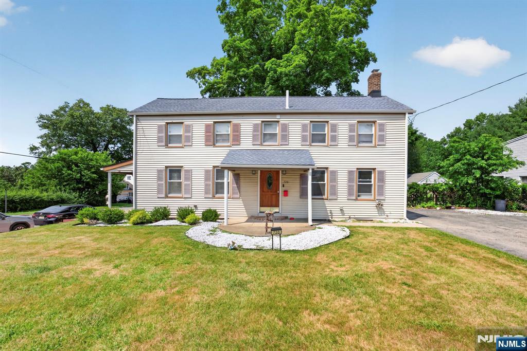 Boasting over 2,100 sq ft of living space, this charming center-hall Colonial perfectly blends timeless character with modern upgrades. From the moment you arrive, the exceptional curb appeal and manicured landscaping welcome you home. Inside, a fantastic floor plan connects the recently renovated spaces, making daily living and entertaining a breeze. The exterior offers ultimate peace of mind, highlighted by a newer roof installed in 2023. The home features three spacious bedrooms and additional den/flex room, including a luxurious primary retreat showcasing elevated ceiling heights that create an airy, grand atmosphere. Both the full and half bath have been completely reimagined with high-end finishes and premium fixtures. Transitioning outdoors, the beautifully manicured backyard offers a private oasis perfect for relaxing or entertaining. Location is everything, and this property delivers an incredible quality of life. Situated in close proximity to the downtown district of Pompton Lakes which is currently seeing a major redevelopment you are moments away from hometown favorite restaurants, local shops, and highly rated schools. Ideal for professionals, the home is close to NYC transportation, offering an easy commute into Manhattan in under an hour. This turnkey Colonial is ready for you to move right in.