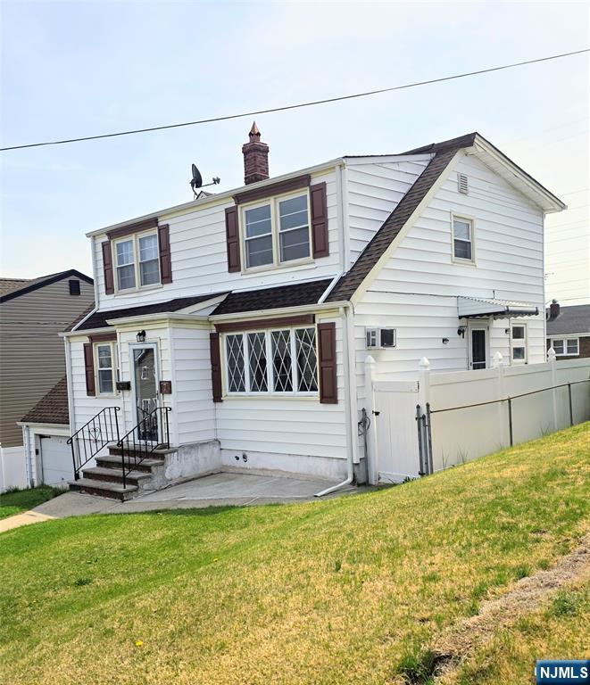 This charming home offers incredible potential and plenty of space to make it your own. Featuring 4 bedrooms, 2 full bathrooms, and 2 half baths, the layout is both functional and versatile. The first floor includes a welcoming living room, formal dining room, kitchen, full bathroom, office, and a convenient first-floor master bedroom with a half bath. Step through the rear door to a large deck overlooking a generously sized, fenced backyardâ€”perfect for entertaining or relaxing. Upstairs, you'll find three additional bedrooms, a full bathroom, and a comfortable TV/lounge room. The fully finished basement adds even more living space, complete with a half bathroom, washer and dryer area, and direct access to the attached garage. Located next to Roosevelt School. House sells AS it's condition.