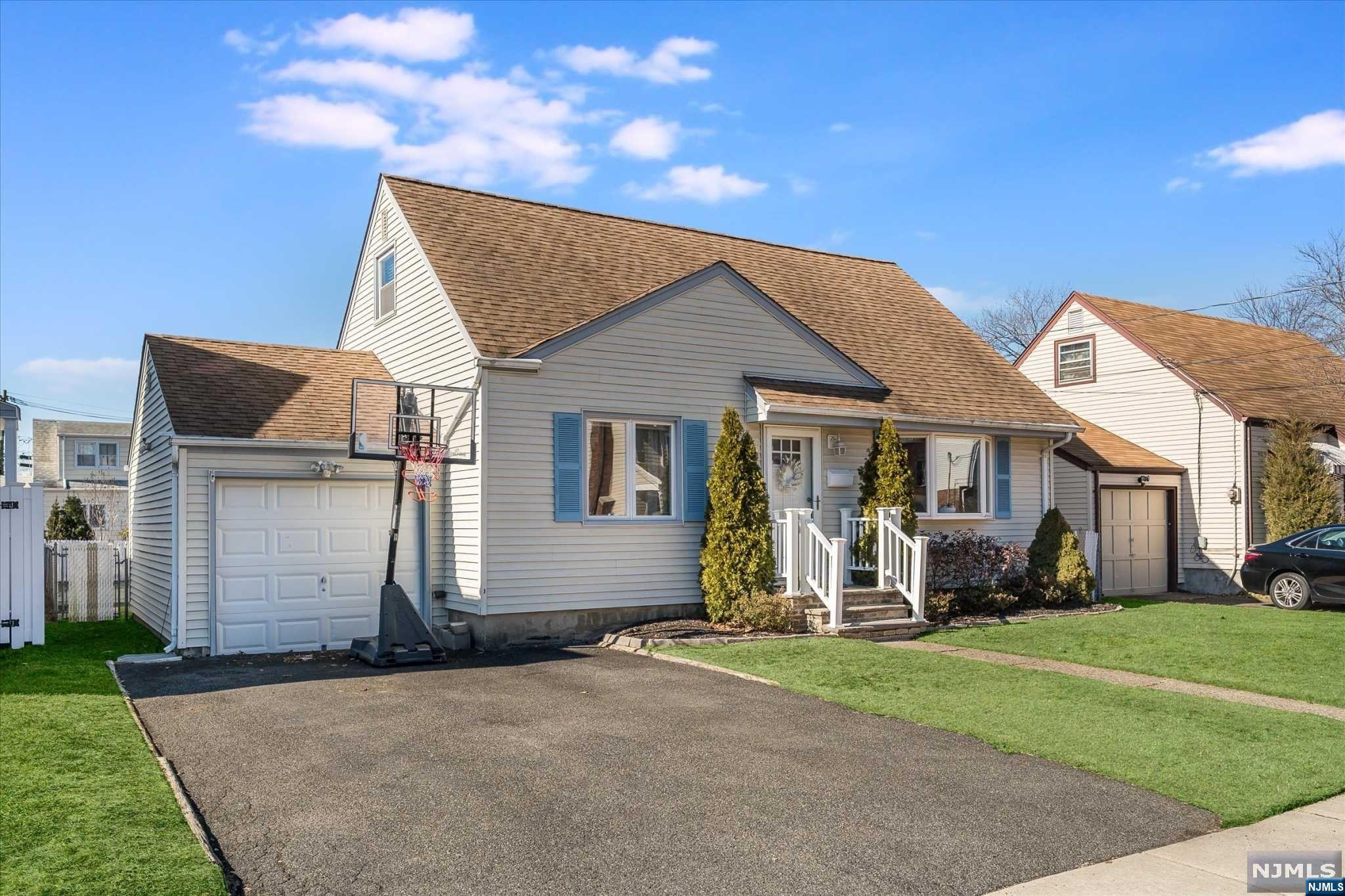 Happiness abounds in this delightful 4 bedroom, 2 bath house located on a quiet cul-de-sac in the desirable town of Fair Lawn! The inviting entry leads to a bright living room and an updated open concept kitchen perfect for today's lifestyle. Two comfortable bedrooms with gleaming hardwood floors and an updated full bathroom complete the main level. The 2nd floor features 2 spacious bedrooms - one with charming built-ins. The finished lower level offers an updated family room space, a gym or convenient home office, full bath, laundry room and lots of storage. The backyard is fully fenced and offers an expansive space to play and entertain! Additional features include central air, recessed lighting, custom blinds and so much more! The location can't be beat - close to New York City transportation, houses of worship, shopping and schools. This is the one you've been waiting for... come make this home yours!
