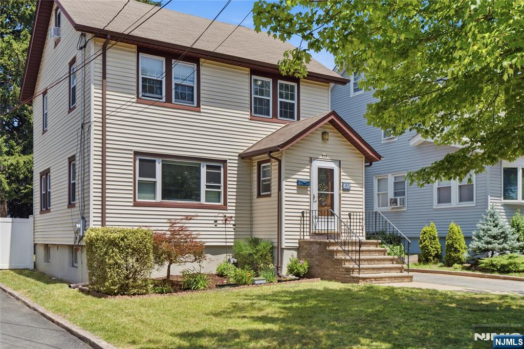 Absolutely charming! This lovingly maintained side hall colonial has a classic layout, ideal for everyday living and effortless entertaining. Enter through a small mudroom to a lovely, spacious, light-filled living room. This area leads to a generously sized formal dining room and kitchen area with pantry. The second level has 3 bedrooms and a full bath. Enjoy a bonus finished attic, ideal for a playroom or den. Down to the finished basement you'll find an open area outfitted for a summer kitchen, complete with a deep utility sink. Two additional rooms offer options for office space, media room, workout area, and more. Completing this level is a large full bath and laundry/utility area. Outside you'll find an extra long driveway leading to a detached garage and the backyard/patio area. Located in a wonderful Teaneck neighborhood, just two blocks from Cedar Lane and a few short blocks to FDU. Also near parks, public transportation, highways, and more!