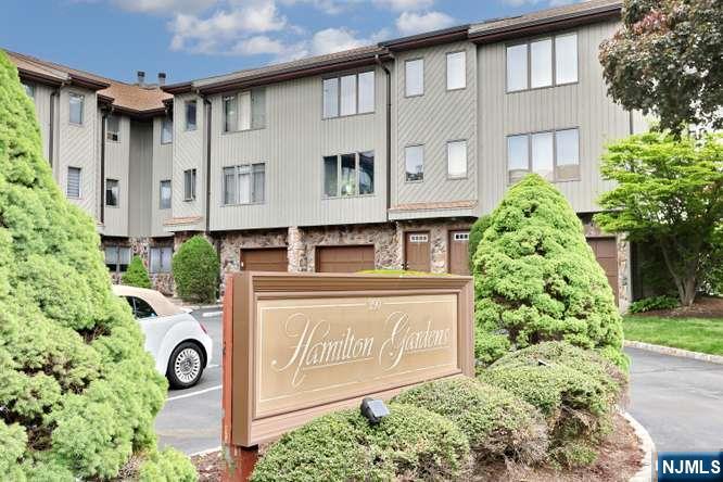 ****OWNER OCCUPIED complex only as only 1 unit in complex is allowed to be rented out and thats taken. ****PETS ALLOWED HERE*** Wonderful oppty to own a big townhouse near all esp trans to NY and malls. Beautiful hardwood floors thruout. Familyroom on main ground floor is currently being used as a bdrm with 3rd fbth and a small living room area w/sgd to fenced in backyard. Laundry in ground floor included in sale. Unit has 1 outside garage parking spot. Current owner bought w/Garage used as storage only. Gorgeous sundrenched skylites in the upper stairwell and the master primary bath. THis townhouse is sold as is with no known issues. All bdrms have walk in closets with lighting sources or window in closet. Gas heat central air ready for summer cooling. XLG bedrooms.