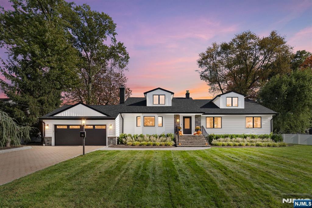 A rare opportunity to own one of Emersonâ€™s most beautifully updated homes with a resort-style pool. This exceptional residence blends modern elegance with timeless design, featuring brand-new siding, stone accents, limestone steps, and a custom front entry that creates striking curb appeal. Inside, a welcoming foyer opens to a sunlit living room with a classic fireplace and bay window, while the banquet-sized dining room is ideal for entertaining. The newly redesigned chefâ€™s kitchen is the centerpiece of the home, showcasing custom white cabinetry, an oversized quartz waterfall island, designer gold fixtures, premium stainless-steel appliances, vaulted ceilings, and abundant natural light. Seamlessly connected to the expansive great room with soaring ceilings, a brick fireplace, and custom built-ins, the layout is designed for effortless everyday living and entertaining. The spacious primary suite features an updated full bath, while two additional bedrooms, a modern full bath, and laundry room complete the main level. Upstairs offers two oversized bedrooms and a full bath, perfect for guests or extended living. The professionally landscaped fenced yard is a private retreat with a heated inground pool, paver patio, and lush outdoor entertaining space. Complete with a two-car attached garage and ideally located near schools, parks, shopping, and NYC transportation, this is luxury living in one of Emersonâ€™s most desirable neighborhoods.