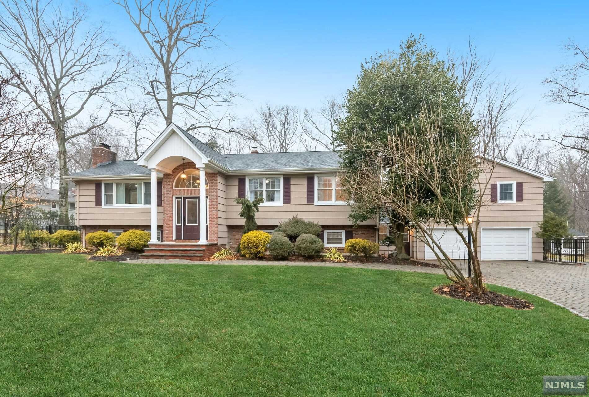 Perfect for extended family! Sprawling 3600+ sq ft home with separate 2 Bedroom suite for in-laws or guests! Set on a gorgeous private property with pool at the end of a cul de sac, this unique home features beautiful hardwood floors, custom millwork throughout & high ceilings. The main section of the house features an open plan living space, large deck, hall bath, & three bedrooms including a master suite. The guest suite has its own entrance, 2 bedrooms, full bath, half bath, updated kitchen & large dining space. A large family room provides additional living space. Everyone will love the outdoor space here with an Anthony Sylvan gunite pool/spa & pool-house with outdoor kitchen, lounge area, half bath & even a wood-fired pizza oven. Top rated school system & close to shops, restaurants & NYC bus & train. A unique opportunity.