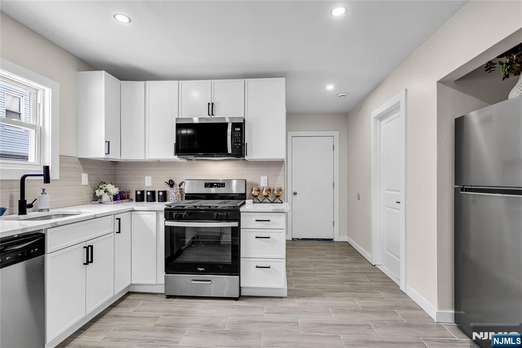 Welcome to 126 22nd St, Irvington â€“ A Beautifully Renovated Home Ready for You! This fully renovated, move-in-ready 4-bedroom, 3-bath home seamlessly blends modern style with functional design. Enjoy a spacious layout filled with natural light, complemented by a brand-new HVAC system and hot water heater for year-round comfort. The open-concept main level features a stunning kitchen with custom cabinetry, granite countertops, stainless steel appliances, a breakfast bar, and a sleek tile backsplashâ€”perfect for both everyday living and entertaining. A versatile first-floor bedroom or home office is conveniently located next to a full bath. Upstairs, you'll find three generously sized bedrooms, including a Jack-and-Jill bath that doubles as an ensuite. The finished attic offers additional living spaceâ€”ideal for a fifth bedroom, home office, or playroom. A fully finished basement with a third full bath adds even more flexibility for guests, recreation, or storage. Located near public transportation, shopping, and major highways, this turn-key property offers the perfect balance of comfort, convenience, and style. Don't miss your chance to make this your new home!