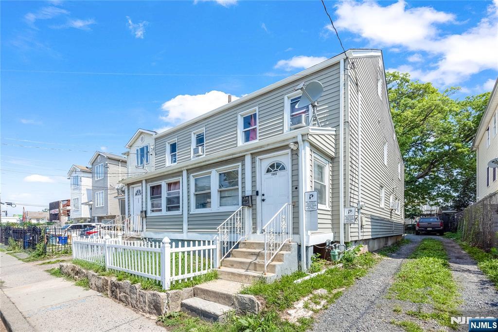 Exceptional side-by-side two-family property offering an outstanding opportunity for investors and owner-occupants alike. Each spacious unit features 4 generously sized bedrooms, providing excellent rental income potential and flexible living arrangements. Each unit welcomes you with a spacious enclosed front porch, perfect for a sitting area, mudroom, or additional seasonal living space. One unit includes the convenience of an in-unit laundry. The property offers separate utilities, a full basement with abundant storage, and two expansive driveways with parking for approximately 10â€“15 vehiclesâ€”a rare and highly desirable feature in Elizabeth. The roof was replaced approximately one year ago, providing added value and peace of mind for the new owner. Ideally located near shopping, restaurants, schools, public transportation, major highways, and Newark Liberty International Airport, this property combines convenience with strong investment potential. Whether youâ€™re looking to expand your real estate portfolio or live in one unit while generating income from the other, this well-maintained multifamily is a fantastic opportunity in a prime location.