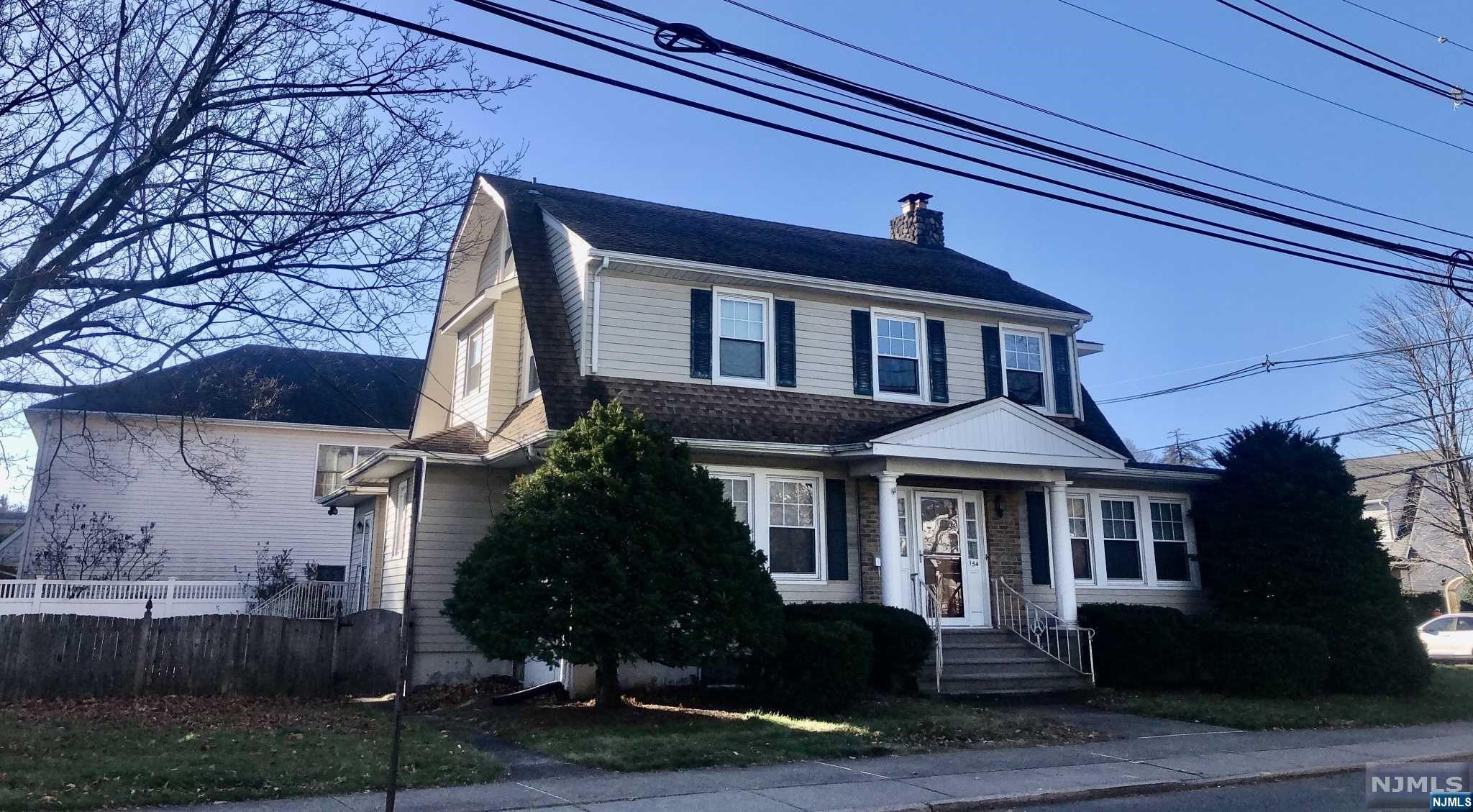 Beautiful home situated in the heart of town, walk to stores, eateries, park, close to school, NYC train and bus. Large corner lot loads of parking and a huge detached 2 garage. home offers 4 Bedrooms on second level, 2 baths, finished walk up attic with 5th bedroom, part finished basement. updated kitchen, baths, windows, leased solar panels. Old world charm and feel, huge stone gas fireplace. All large rooms, sliders to large deck and so much more. Must See