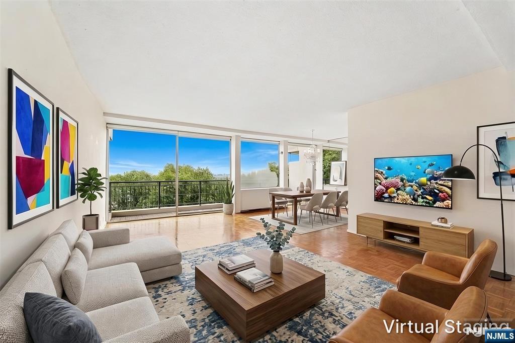 CONTACT DEBRA JACOBS (201) 803-3191 & HALLEY NATKIN (917) 626-8240 COLDWELL BANKER FORT LEE...DIRECT FOR MORE INFORMATION AND A PRIVATE TOUR! Garden Sanctuary Townhome Style Living, No Elevators Required A three-level upsplit that lives like a townhome: private entry, two bedrooms, two baths, and your own reserved PREMIER parking space (deck #14) steps from the door no elevators. East and west exposure delivers both ends of the day, sunrise over the Hudson and sunset behind the skyline, with seasonal GWB and NYC views and a brook below a setting found only at Horizon House, Fort Lee. Inside: a spacious working kitchen, renovated baths with granite and Porcelanosa tile, and a living/dining room behind a wall of windows opening to a 24' balcony in wood tile with river rock accents. Situated on 32 landscaped acres in the heart of Fort Lee, with 24-hour doorman, security, community room, gym, two pools, two tennis courts, play areas, and a convenience store. All-inclusive maintenance is $2,761.52/month and covers everything utilities, taxes, amenities, and parking (maint $1,221.47; taxes/utilities/underlying mortgage/insurance $863.06; assessment $506.25; parking $79.20; cable/internet $71.54; amenities $20). *Maint. Fees are partially TAX DEDUCTIBLE! Board approval required, 4:1 income-to-debt ratio; all-cash purchases require $132K min gross income w/no other debt. *SOME PHOTOS VIRTUALLY STAGED. **CHECK OUT 3D TOUR!