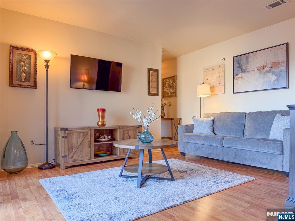 Welcome to 700 Schuyler Ave. Unit A21. This neat and pet friendly, 1-bedroom 1-bathroom apartment offers a great layout while modern features like central AC ensure year-round comfort. Enjoy the peace of mind of having one assigned parking space and your very own in-unit washer and dryer. This well kept, 698 sq. ft. unit includes a living room, private balcony, eat-in kitchen with classic solid wood cabinets, granite counters, new backsplash, newer refrigerator, dishwasher (new to be installed), and gas stove. Relax in your serene king-sized bedroom boasting an ample 9ft. closet. Centrally located for effortless commuting just steps from NJ Transit buses and trains, and nearby shops and restaurants.