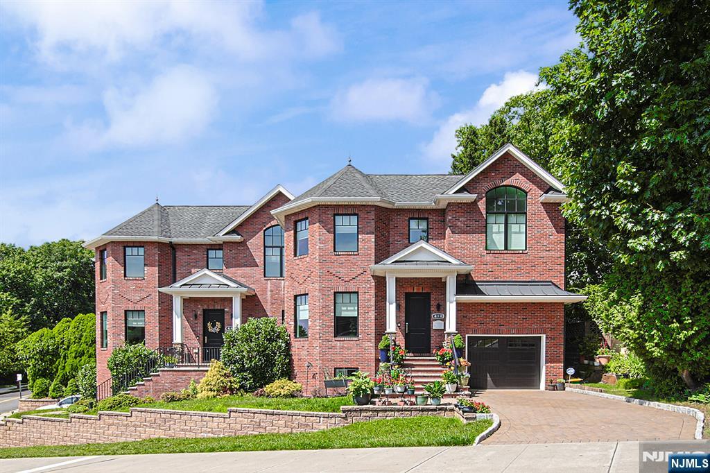 Exceptional all-brick side-by-side duplex built in 2019, offering the privacy and feel of a single-family home with premium craftsmanship and modern finishes throughout. Beautiful white oak hardwood floors lead to a bright, open-concept living and dining area, perfect for everyday living and entertaining. The designer kitchen features Bosch stainless steel appliances, quartz countertops, a full-height quartz backsplash, custom cabinetry, an exterior-vented range hood, and a stunning waterfall-edge center island. Upstairs, the luxurious primary suite boasts dual walk-in closets and a spa-inspired bath with a soaking tub, oversized shower, and dual vanities. Spacious secondary bedrooms, LED lighting, and quality finishes complete this move-in-ready home. Ideally located at 419 Stillwell Avenue in one of Fort Lee's most desirable neighborhoods, you'll enjoy quick access to the George Washington Bridge, Routes 4, 46, and I-95, making commuting to NYC effortless. Just minutes from downtown Fort Lee's shopping, dining, parks, and entertainment, this home is also served by the highly regarded Fort Lee School District, known for its excellent academic reputation.
