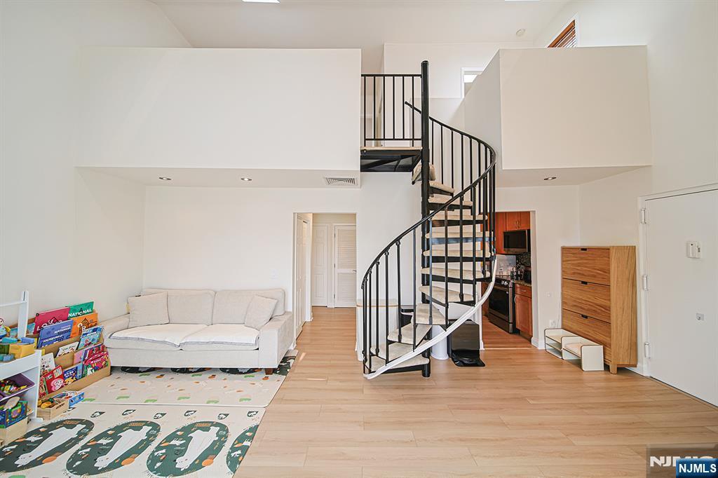 Welcome to this beautifully renovated 2-bedroom, 2-bathroom duplex residence offering the perfect blend of modern comfort, stylish design, and everyday convenience in one of Englewood's most desirable communities. Featuring two-floor living, this spacious home is enhanced by soaring high ceilings and an abundance of natural light, creating a bright and inviting atmosphere throughout. The recently renovated interior showcases a modern kitchen equipped with brand-new stainless steel appliances, updated finishes, and an open layout ideal for both daily living and entertaining. Enjoy the convenience of in-unit laundry, central air conditioning, and ample storage, all designed to provide effortless living. This home also includes two dedicated parking spaces, making commuting simple and convenient. Perfectly situated with easy access to New York City transportation, major highways, shopping, restaurants, and local parks, the location offers the best of both suburban comfort and urban accessibility. The community is also pet-friendly, making it an ideal place to call home for every member of the household. Move right in and experience turnkey living in this beautifully updated Englewood residence where style, comfort, and location come together seamlessly.