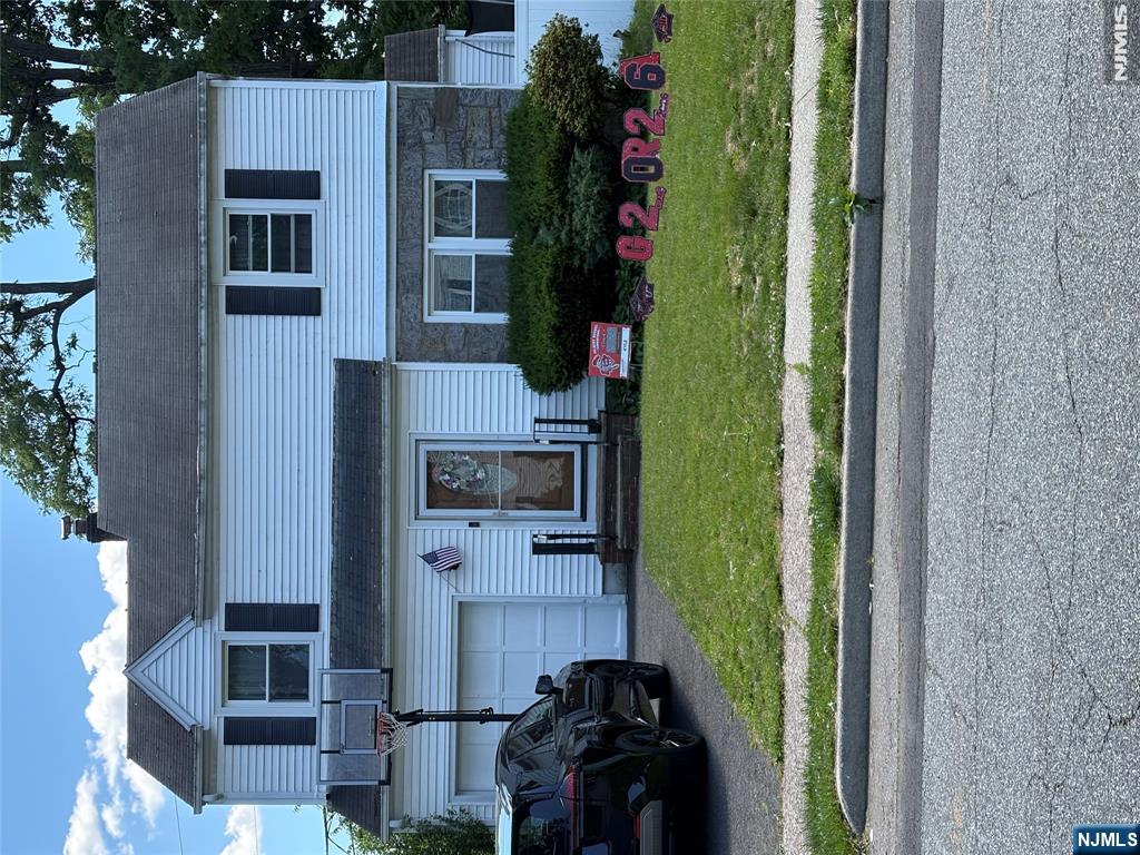 Beautiful 3 bedrooms colonial, freshly painted, finished hardwood floors throughout, 2 full bathrooms completely renovated with heated floors. The first floor offers entrance closet, living, formal dining room, bright den, renovated kitchen and full bath. On the second floor you will find three spacious bedrooms and full bath. Partially finished full basement provides washer/dryer and additional storage. Attached garage and nice fully fenced backyard with storage shed. There are solar panels for energy savings. House locates close to park, schools, shopping. Prime street in Elmwood Park.