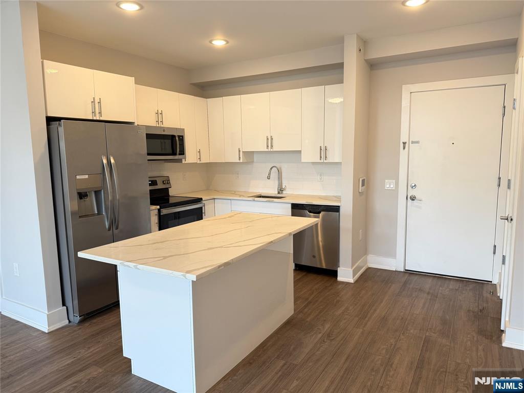 **ONE MONTH FREE on 13-month lease + one parking space included! - for occupancy commencing on or before 9/1/25!** Welcome to The Addison - Fort Lee's new luxury rental building offering a variety of upscale, spacious floor-plans. The Addison offers high-end residences fully equipped w/ modern kitchens w/ stainless steel appliances, quartz countertops, full islands & tiled backsplashes, open living/dining areas, shades on all windows, modern bathrooms & a full-sized washer & dryer in each unit. Exclusive 24/7 virtual doorman service for communications, package deliveries & access control via video intercom system linked to your smart phone. The Addison includes a large on-site fitness center including virtual touchscreen workout mirror, electric car charging stations & parking garage w/ direct elevator access to all residences for uncompromising security. Pet friendly - (25 lb limit) $500 pet fee + pet rent per month! Tenants pay ALL utilities! All amenities INCLUDED in the rent! PARKING: 1st space - $125/monthly (excluding promotion) ; Additional space - $100/monthly. Virtual tour available upon request!