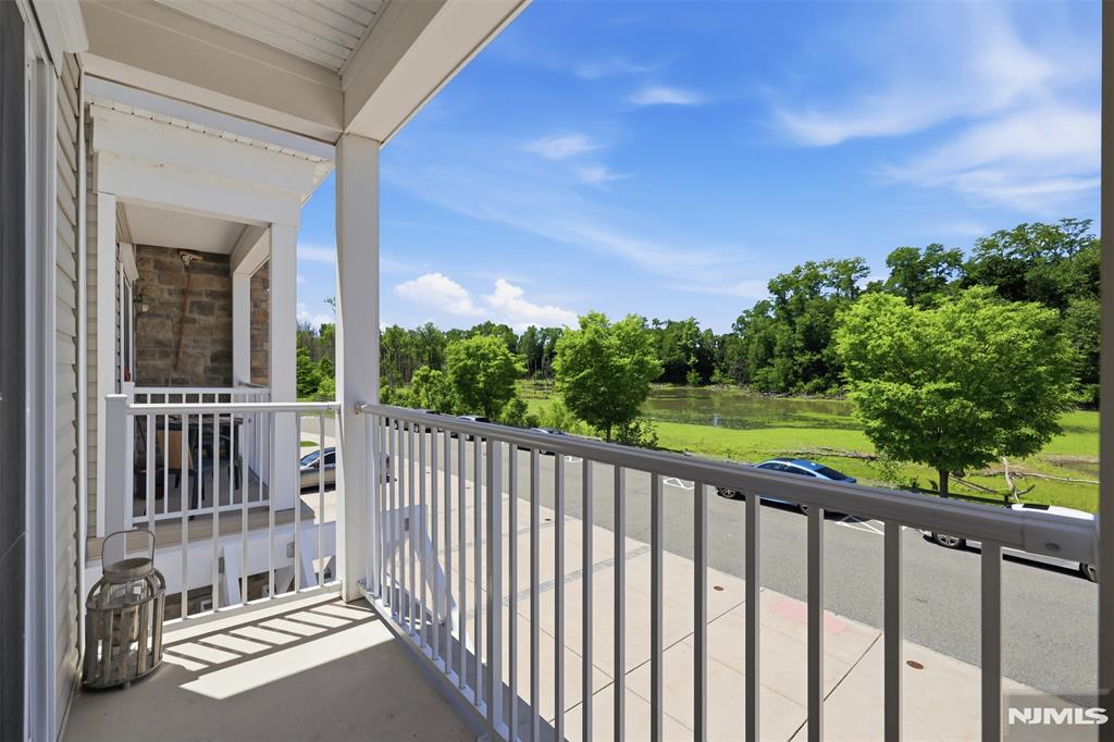 Like-new townhome in a sought-after Morris County location move-in ready and meticulously maintained from top to bottom. This stylish 3-bed, 2.5-bath end unit offers the space and flexibility today's buyers are looking for, whether you're commuting to the city or working from home. Enter into a welcoming foyer with direct garage access, then head up to the main living level where hardwood floors transition to a bright, open living and dining area, galley kitchen with breakfast bar, powder room, and a private balcony perfect for morning fresh air or unwinding after a long day. The upper level features well-planned primary suite with walk-in closet and full bath, plus two additional bedrooms one with treetop views, one with a walk-in closet a full hall bath, and a dedicated light bright laundry room. Freshly painted and professionally cleaned throughout truly turnkey. Low maintenance fee and low taxes make this an exceptional value. Floor plan in media section. Close to major shopping, commuter train lines, and key highways. Don't miss this Waterview in Cedar Knolls unit.