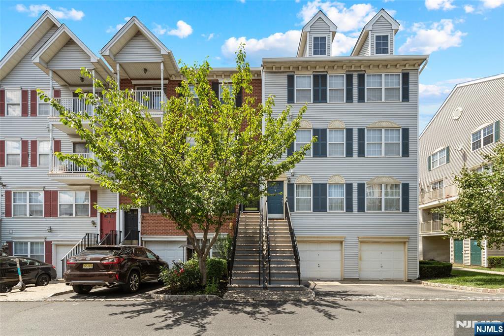 Enjoy spacious, modern living in this top-floor duplex condo at Society Hill in University Heights, one of Newarkâ€™s most sought-after communities. Move in ready, freshly painted throughout, well maintained plus new flooring in most areas. The 1st level features a bright living room w/ a private balcony, separate dining, eat in kitchen & powder room. Upstairs, you'll find 2 bedrooms, 2 bathrooms, laundry room and extra storage. The primary suite offers a sizable bathroom w/ a double vanity, a generous closet & a 2nd exclusive balcony. The home includes 2 car parking, a dedicated driveway plus oversized garage w/ tons of storage space. Residents enjoy access to community amenities like a swimming pool, tennis courts, a clubhouse, 24-hour security & on-site property manager. Conveniently located minutes from the Light Rail, Newark Penn Station & NYC buses w/ easy access to Rutgers, NJIT, University Hospital & downtown dining, shopping, Whole Foods, NJPAC & Prudential Center.