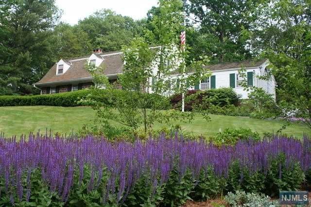 PICTURE PERFECT SETTING...SET HIGH ON TENAFLY'S EAST HILL, ON A PRIVATE CUL-DE-SAC IS A BEAUTIFUL CENTER HALL COLONIAL. INVITING ENTRY FOYER,LARGE FORMAL LIVING ROOM WITH FIREPLACE, FORMAL DINING ROOM, HANDSOME LIBRARY, EXPANSIVE UPDATED KITCHEN WITH BREAKFAST AREA, POWDER ROOM; WHICH HAS ACCESS OUT TO THE REAR PATIO AND CAN BE USED AS A CABANA FOR THE POOL, GORGEOUS GREAT ROOM WITH A PALLADIUM WINDOW, HIGH CEILING, EXTENSIVE TRIM WORK AND A FIREPLACE, EN SUITE BEDROOM, MUDROOM AREA & LAUNDRY RM COMPLETE THE MAIN FLOOR. SECOND FLOOR FEATURES A PRIMARY BEDROOM SUITE, 2 ADDITIONAL BRS AND FULL BATHROOM. LOWER LEVEL REC AREA & STORAGE. SPECTACULAR PROPERTY WITH LARGE PATIO, GUNITE POOL AND VERY PRIVATE LUSH LANDSCAPING. EQUIPT WITH A FULL HOUSE GENERATOR. CLOSE TO THE TENAFLY NATURE CENTER, SHOPPING, SCHOOLS AND TRANSPORTATION TO NYC. TENAFLY BLUE RIBBON SCHOOLS...DON'T MISS OUT ON THIS AMAZING OPPORTUNITY!!
