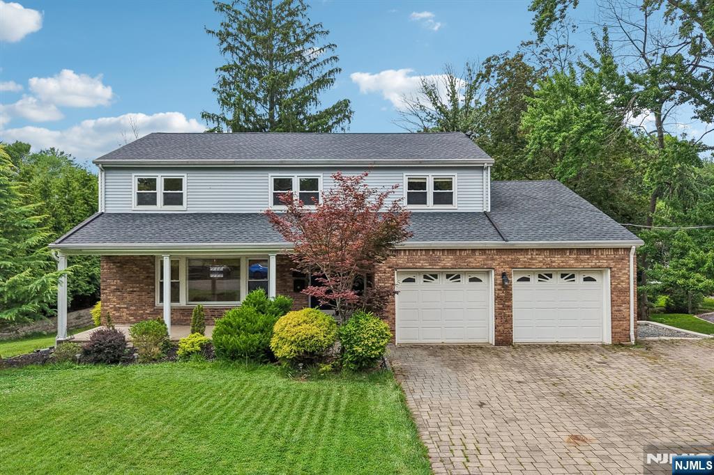 Welcome to this beautifully appointed 4-bedroom, 2.5-bath single-family home nestled in the highly sought-after community of Demarest. The inviting main level showcases a sun-filled living room, elegant formal dining room, and a warm family room anchored by a charming brick fireplace. The thoughtfully designed eat-in kitchen features granite countertops, stainless steel appliances, a cozy breakfast nook, pantry, and seamless access to a spacious rear deckâ€”perfect for entertaining or relaxing outdoors. Upstairs, youâ€™ll find four generously sized bedrooms, including a luxurious primary suite complete with dual closets and a private bath. An additional full bathroom and a conveniently located laundry area add to the homeâ€™s comfort and functionality. The finished basement offers versatile living space ideal for a recreation room, home office, gym, or playroom, along with a separate unfinished utility area for added storage. Additional highlights include gleaming hardwood floors, central air conditioning, a two-car garage, and a wide driveway. Enjoy outdoor living on the covered front porch or in the private, tree-lined backyard featuring a patio and gazebo areaâ€”perfect for gatherings or quiet retreats. Ideally located near top-rated schools, parks, shopping, dining, and transportation, this exceptional home offers the perfect blend of comfort, style, and convenience.