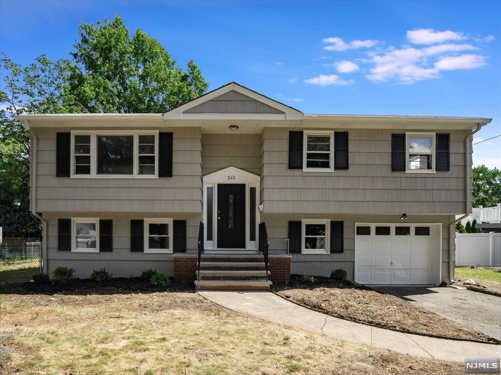 Completely renovated home. Magnificent gourmet kitchen with stainless steel appliances and custom cabinetry. Gleaming hardwood floors on main level and new interior doors and trim. Both bathrooms are brand new. Sliders off dining room lead to large deck. Lower level has laminated wood flooring. Family room, bedroom, laundry room, 1/2 bath, mudroom, and den on the lower level. One car garage. Large level lot. Move in ready.