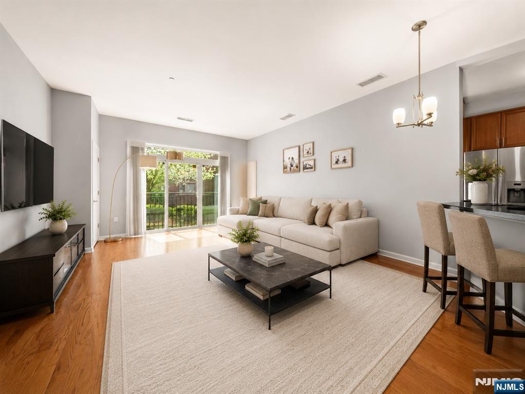 Some homes you have to sell. This one sells itself the moment you walk in. The M at Englewood South offers a bright, southeast-facing 1 bedroom, 1.5 bath residence of about 900 sq ftâ€”and that orientation is the first thing buyers notice. Sunlight moves through the home all day, warm and steady, never harsh. Paired with 10 ft ceilings and an open layout, the space lives far larger than the square footage suggests. The kitchen has been updated with new stainless steel appliances and opens directly into the living and dining area, so it never feels boxed off the way older floor plans do. The primary bedroom is a real retreat, with a walk-in closet and private bath. And here's a detail buyers rarely expect in a 1 bedroomâ€”a separate powder room, which makes all the difference when guests come over. Behind the scenes, the important things are handled: a new furnace and updated water heater mean fewer near-term surprises. Parking is usually the headache here, but not in this homeâ€”two dedicated spaces, plus guest parking. The HOA covers water, heat, cable/internet, and amenities, so electricity is your only separate utility, which makes budgeting far simpler than people expect. Residents enjoy a renovated lobby, a clubhouse, and an outdoor pool, and the location keeps everything within reach: minutes from Downtown Englewood, major highways, and quick access to the George Washington Bridge and Manhattan. Bright, low-maintenance, and genuinely move-in ready.