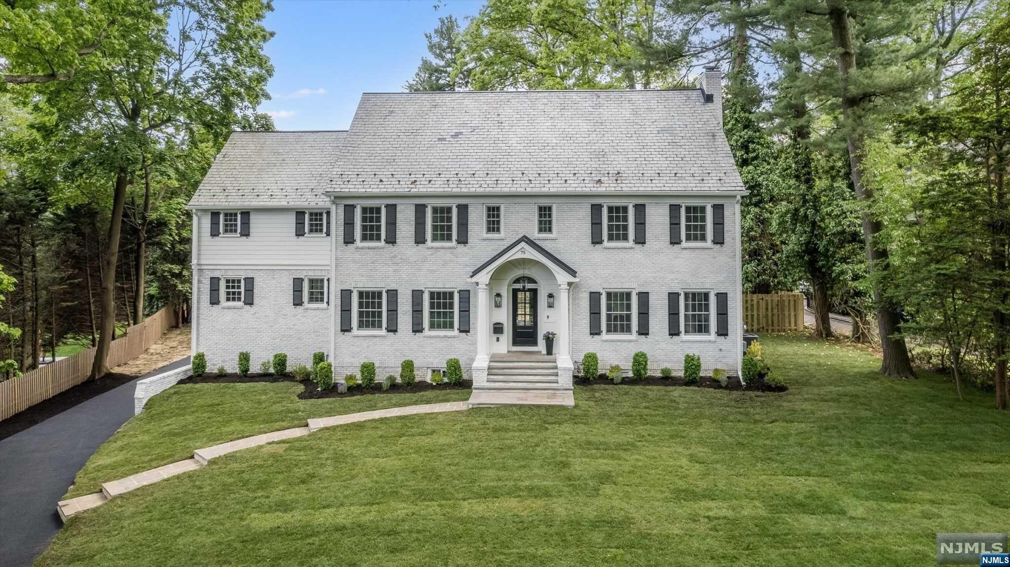 Estate section beauty artfully designed & thoughtfully renovated w/ the utmost consideration of the past & present. Timeless, architectural detail, sophisticated finishes & modern comfort embrace this Colonial filled w/ formal & informal spaces. Gracious foyer & beautiful stairway, the 1st flr is perfection w/ sunken liv rm w/ coffered ceiling, wood burning fp & doors leading to bluestone patio. The formal din rm w/ wet bar (wine fridge, dishwasher). The kitchen, a chef's dream w/ herringbone wood flring, 6 burner Wolf range, custom cabinetry w/ toe kick lighting, Viking fridge, double ovens, pot filler,lrg island w/ quartz counters & ample storage.library w/ bookshelves & gas fp w/ doors to covered deck, & wallpapered pwdr rm.Primary bdrm includes dressing rm & bth w/ soaking tub, dual vanities & radiant heat flr.3 bdrms, 1 w/ balcony,1 w/ensuite bth, hall bth & lndry. Attached garage, mud rm, fin basem't. Fenced private yard, so close to downtown Montclair & NYC transportation.