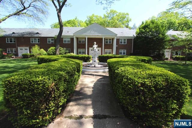 Meticulously kept 2 bedroom condominium in Scarborough Manor, one of the most sought after complexes in town. Walk through the manicured English garden to this beautifully appointed apartment. An open floor plan greets you when you enter this European style living space. The kitchen cabinets and appliances are imported and were custom designed. Appliances are top of the line. There are hardwood floors throughout. The unit has been freshly painted. Heat and hot water are included in the maintenance fee. All of this in a complex with English style garden courtyard, minutes to town, NYC bus, worship and schools. Please note that there is an assessment of $134.00 until 2035. Parking a #51 garage assignment. Laundry and storage is on site. Cats allowed, no dogs allowed.
