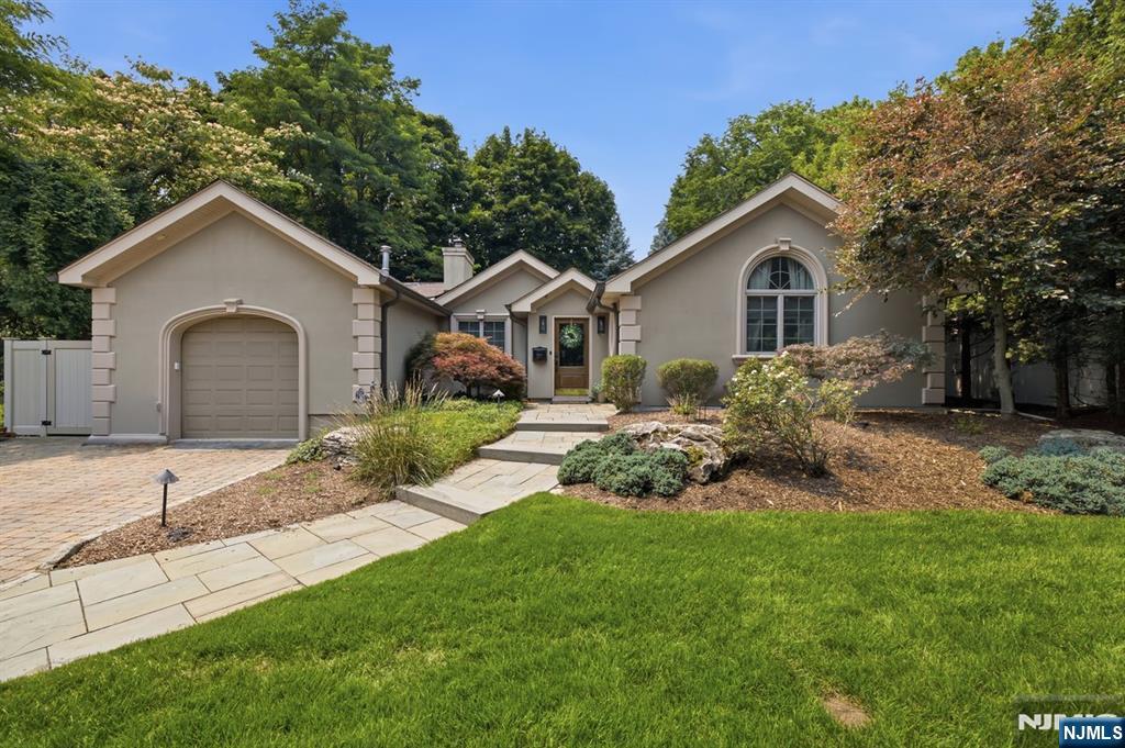 23 Trinity Place is a beautiful ranch-style home offering true one-floor living. This residence combines comfort, function, and convenience in the sought-after town of Hillsdale. Located on a quiet street, the property is in close proximity to NJ Transit train & bus service, providing convenient access for commuters. The heart of the home is a large family room featuring a high arched ceiling and French doors leading to the patio and pool area. The living room includes a beautiful fireplace with a classic mantel, creating a comfortable gathering space. The adjacent kitchen is equipped with stainless steel Viking/Sub-Zero appliances, providing a functional workspace with ample storage. Bedroom layout supports flexible use, whether for sleeping quarters, home office, or guest space. Step outside to a private backyard oasis with a beautiful heated in-ground pool, ideal for relaxation and seasonal enjoyment. Additional highlights include Hillsdaleâ€™s strong school system, close to the town center, local parks and access to major roadways. Roof replaced 2022, central air replaced 2022, furnace replaced 2020, pool liner replaced 2024, fence replaced 2022. Schedule a showing today!