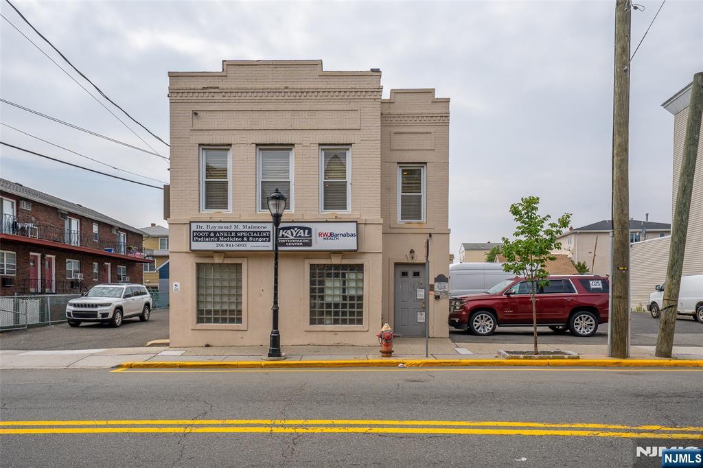 Mixed-use building on a double lot offers the perfect blend of income-producing commercial space and comfortable residential living, all in one turnkey property. Located in a high-visibility area with excellent foot traffic, this two-story building features a spacious commercial unit on the ground floor and a private one-bedroom residential apartment on the second floor, previously a 2 bedroom but 2nd bedroom was converted to a walk in closet. Commercial Highlights (First Floor):Prime street-level office space currently a doctors office,property offers high-visibility signage opportunities Residential unit features, high ceilings, abundant natural light. Residential Highlights (Second Floor):Private, self-contained living unit with its own entrance and staircase Peaceful separation from the commercial space while remaining conveniently close Ideal for owner-occupant, live-work arrangement, or additional rental income Low maintenance building with off-street private lot parking for multiple vehicles. Excellent location with easy access to, transportation Perfect for entrepreneurs, investors, or professionals seeking a live-work solution. Property is on a double lot with potential development opportunities. Whether youâ€™re looking to run your own business downstairs while living above, or simply want a smart investment with built-in residential upside, this mixed-use property delivers versatility. Schedule your private showing today.