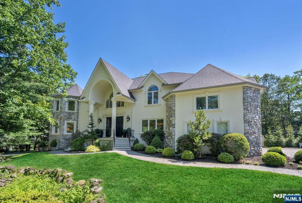 Designers own home, fully renovated with stunning finishes. Set back on private lot w/mature landscaping & picturesque setting. Dramatic entry w/custom iron double doors, 2 sty EF opens to the most beautiful interior w/open floor plan & high-end finishes. Great rm features flr to ceiling windows, FP, & wet bar w/hammered copper sink, while the formal dining rm w/new custom glass doors is breathtaking. New chef's kitchen boasts a waterfall quartz island, custom cabinets, quartz backsplash & high-end appliances. Separate bkfst rm showcases sliders to pool & patio. 2nd primary ste on 1st fl offers a large WIC, lux bath w/ soaking tub, tiled shower & dual vanity. A 1st fl office, full BA, lndry & addâ€™l study/craft rm complete the main lvl. The 2nd lvl offers a grand mezzanine, 2 large BRs w/J&J bath, grand shower & dble vanity, an addâ€™l expansive BR w/ensuite bath. The primary ste is spectacular w/double-door entry, vaulted ceiling, custom WIC & spa-like bath w/soaking tub, tiled shower, water closet, double vanity & makeup area. Private office w/custom barn doors completes the 2nd flr. Finished walk-out lower lvl offers a large media rm, gaming area & abundant storage. The backyard is a retreat w/pool, spa, pavilion, & large patio. Professionally landscaped grounds enhanced by landscape lighting & sprinklers. Radiant heat tile floor thruout, new roof 10/25, recently painted exterior, heated 3-car garage w/custom floor, central vac, 3 new ACs. Top rated schools w/easy commute