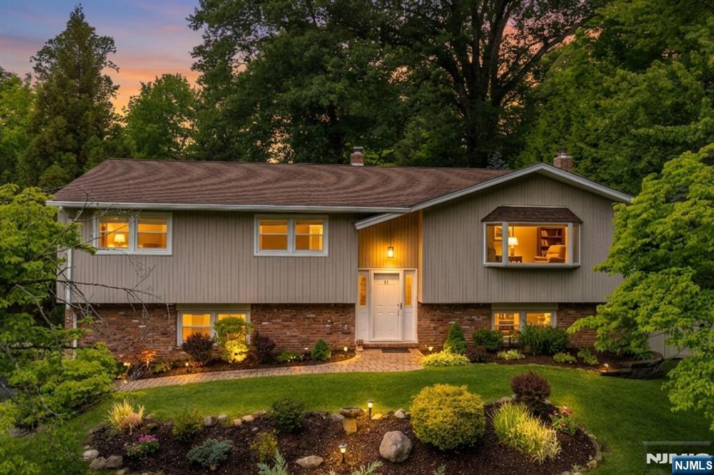 Tucked away in a quiet, secluded location where neighbors are out of sight and privacy is paramount, this beautifully expanded and renovated home offers the option for multi-generational living. The main level boasts a chef-inspired kitchen renovation featuring a huge double island, double ovens, and abundant cabinetryâ€”perfect for hosting a crowd. Nature lovers will gravitate toward the breakfast nook, a sun-drenched corner offering peaceful views of the vibrant gardens and Japanese maples. Adjacent to the living areas a bonus space provides a quiet escape, library or office space. The walk-out lower level has the option of secondary living quarters and offers grade level access. Ideal for extended family, au pair, adult children or long-term guests, this expansive suite includes a large kitchenette, a spacious family room, full bathroom and bedroom ensuring comfort and independence under one roof. Outside, the grounds are a "gardenerâ€™s delight," featuring lush perennial plantings, a dedicated greenhouse, and total seclusion. Whether you are listening to the birds on the patio or tending to the gardens, youâ€™ll feel worlds away from the hustle and bustle. No detail has been overlooked in the maintenance of this home. With a whole-house generator, newer furnace, water softener, and a freshly paved driveway, all the heavy lifting has been done for you. Experience the perfect blend of space, serenity, and sophisticated design. OPEN HOUSE Thurs June 4, 6pm-7:30pm.