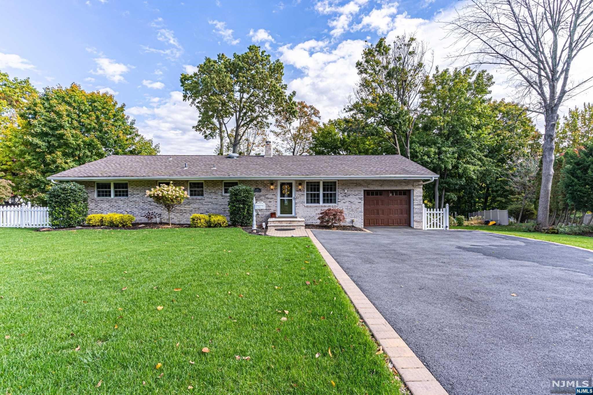 Immaculate & fully updated ranch-open concept living. Step in & be wowed by 2 sided stack stoned fireplace. Newer white kit w granite, stainless steel appliances & custom pantry. Newly finished hardwood floors & crown molding throughout first floor. Three large bedrooms w custom closets & 2 fully updated baths are found on the 1st floor. Walkout Ground Level Basement features an open concept living area that will impress all (possible in-law suite) with separate entrance, kitchenette, living & dining area,2 rooms w closets, 2 full baths, and laundry room. Backyard paradise has synthetic deck with white railings, custom paver patio & walkway, hot tub, & fireplace. Property is equipped w sprinkler system, Simply Safe security system, doorbell, perimeter cameras, & sensor lighting. +Enjoy all that Wayne offers: excellent schools (Fallon Elem, AWMS & WVHS), Trader Joe's, Whole Foods, Boys & Girls Club, Y, PAL, James Roe Pool & more!