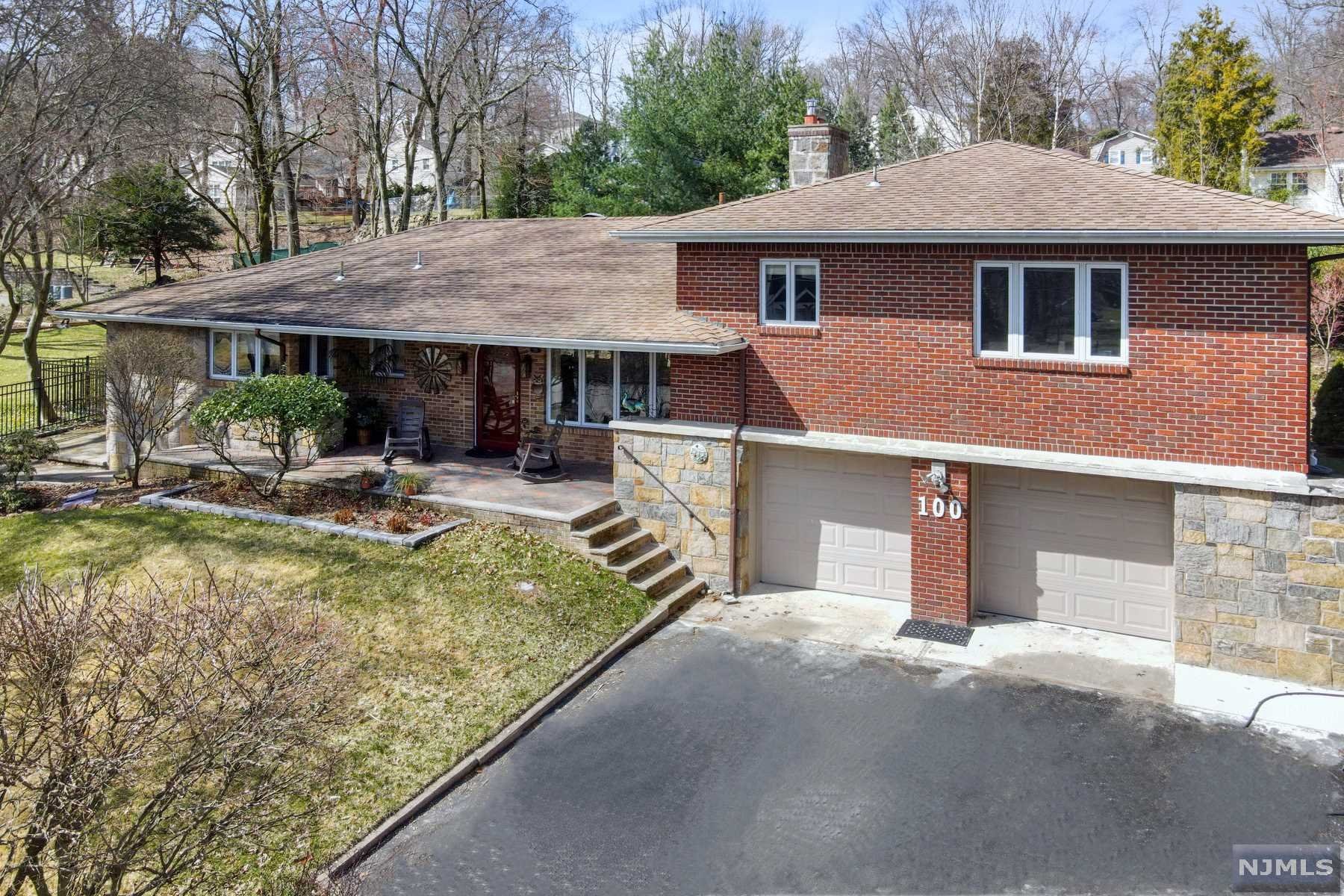 This custom Westwood home has features not found in many homes. Beautiful craftsmanship throughout, stonework, gorgeous wood trim and a stunning layout and design. Wait until you see the property, it will make you say wow, over a half acre! Plus a newer boiler, water heater, primary bath with radiant heat, and much more. A tremendous basement/ half bath, cedar closets, with unbelievable potential. A very spacious garage for car enthusiasts. The yard is full of plantings and is a real Spring/summer show case. The yard is beautifully fenced in. Come and make this home your own.