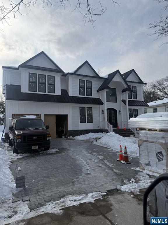 Stunning new construction by premier Paramus builder featuring 5 bedrooms and 6.5 baths. Highlights include a two-story foyer, formal living and dining rooms, chefâ€™s kitchen with high-end stainless steel appliances, quartz center island, custom cabinetry, and open-concept great room with fireplace. First-floor bedroom with full bath. Luxurious primary suite with fireplace and spa-style bath. Three additional bedrooms and second-floor laundry. Fully finished basement with rec room, home theater, and full bath. New construction on existing foundation. Located on Paramusâ€™ desirable west Side.