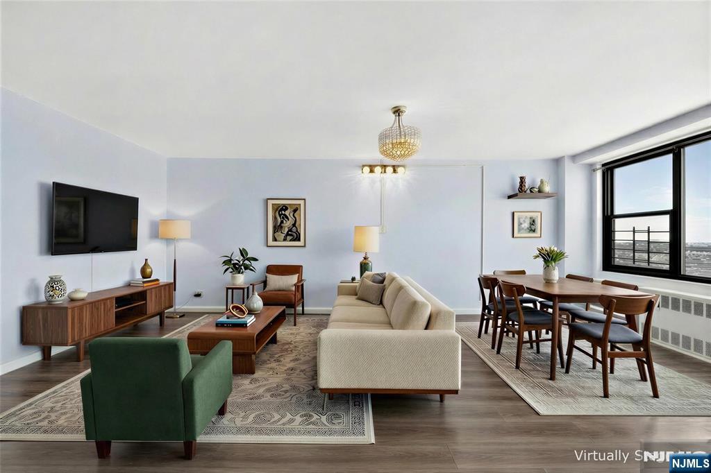 Welcome to Residence 8J, a spacious and well-maintained 1-bedroom + den, 1-bath condo on the 8th floor of a sought-after full-service building in Journal Square. Offering approximately 958 sq ft, this bright home features oversized windows, an open layout, and a private balcony with open sky viewsâ€”perfect for relaxing or entertaining. The updated kitchen includes stainless steel appliances, a smart refrigerator, and ample cabinetry. Just beyond, three walk-in storage closets provide exceptional space rarely found in condo living. A dedicated home office nook is wired for Verizon Fios, ideal for remote work. The flexible layout allows the den to be used as an office, guest space, or additional living area. The updated bathroom offers a clean, modern finish. Heat and hot water are included in the HOA, adding value and convenience. Residents enjoy full-service amenities including a 24-hour concierge, fitness center, pool, on-site laundry, and optional parking for $110/month. Located just moments from the Journal Square PATH, this home offers easy access to Manhattan and is surrounded by dining, shopping, and neighborhood favorites. Residence 8J is a rare opportunity to enjoy space, comfort, and convenience in a prime Jersey City location.