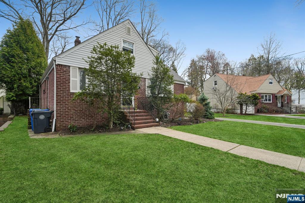 Tucked away on a quiet ,tree street just one block from Janis Dismiss Middle school this home is set on a park-like, extra wide property offering privacy and presence . Inside natural hardwood floors throughout a home with nice flow, complemented by bright sunlight that fills each space. Features 4 generously sized bedrooms and 2 baths, a newer roof , 1 car attached garage. A rare combinations of space, light and location in one of Englewood's most desirable settings.Lender may require flood insurance policy.