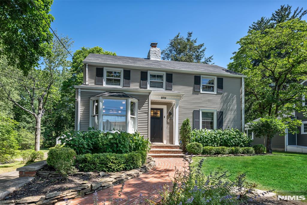 Exceptional style, flawless updates, and a coveted cul-de-sac setting define this turnkey 4-bedroom Colonial, set on a gorgeous level property. Young, fresh, and pristine throughout, this move-in-ready home blends timeless charm with modern sophistication. At its heart, the stunning new kitchen showcases custom wood cabinetry, luxe soapstone countertops, a built-in banquette, aged brass hardware, and elegant Hudson Valley alabaster drum fixtures, flowing effortlessly into the home's inviting living spaces. Filled with natural light, the living room with fireplace opens to the family room, creating warm, welcoming spaces for everyday living and entertaining. Four spacious bedrooms and updated baths provide comfort and flexibility, with a designer-inspired aesthetic. Outside, the 190-foot-deep backyard extends the home's appeal with a large new patio for dining and gatherings, an oversized tandem garage, and a vegetable garden. Peacefully tucked away yet close to everything, this exceptional property offers the rare opportunity to embrace effortless turnkey living in a truly special setting. A must see!