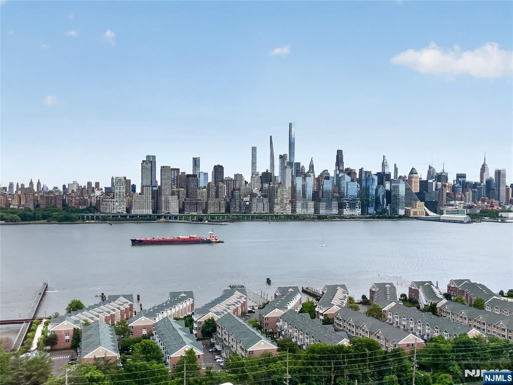 Welcome to this beautifully updated 2BR 1BTH Condo located on Prestigious Blvd East, offering an unbeatable 20-minute commute to New York City with a bus stop right at your doorstep!!! This bright and inviting unit features a modern kitchen with stainless steel appliances, quartz countertops, and a sleek glass tile backsplash. The updated bathroom includes a high-tech toilet and stylish stand-up shower, while the custom-designed closets provide excellent storage and organization. Rich hardwood floors run throughout the home adding a sense of warmth and elegance!!! Enjoy breathtaking Panoramic Views of the NYC Skyline and the Hudson River from every window - an exceptional highlight that truly sets this home apart!!! The full-service building offers a doorman, elevator, fitness center, and on-site laundry for your convenience. Best of all, the seller currently rents a garage parking space in the building for $300/month, with the option to transfer it to the new owner!!! Don't miss this incredible opportunity to own a move-in ready condo in one of the area's most desirable locations and sought out buildings!!!