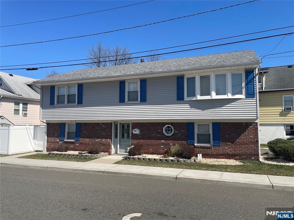 Beautifly maintained completely renovated 3 bedroom Raised Ranch. First Level offers large living room, family room (which could be used as 4th bedroom), den. Second level includes modern kitchen with breakfast bar, living room, hugh dining room, 3 large bedrooms and full bath. Conveniently located near schools, parks and NYC transportation. This is one you do not want to miss!!