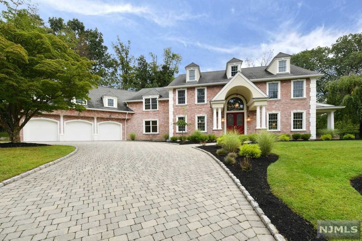 STUNNING ALL BRICK COLONIAL HOME. 3 LEVELS OF LUXURY LIVING WITH OVER 9000 SQ FT. ENTER TO A GRAND 2 STORY EF W/SWEEPING STAIRCASE, LR W/FP, BANQUET SIZE DINNING ROOM & BTLRS PNTRY. BRAND NEW MAGNIFICENT DREAM KTCHN W/HIGH END CABINETS AND APPLIANCES, CIRCULAR BREAKFAST NOOK WITH BEAUTIFUL WINDOWS OVERLOOKING THE POOL. THE KITCHEN OPENS TO A MAGNIFICENT GREAT RM W/FP AND WALLS OF WINDOWS AND 2 DOORS TO THE BACKYARD. SPACIOUS HOME OFFC, 1ST FL BR W/FL BTH, LARGE MUD RM AND 3 CAR GARAGE COMPLETES THE FIRST FLOOR. THE 2ND FL BOASTS A GRAND MBR STE W/2 WIC'S, SITTING AREA, NEW BATH W/DUAL VNTS, STEAM SHWR & FREE-STANDING TUB. 2 ADDT'L LARGE BRS ENSUITE, 2 MORE LARGE BEDROOMS WITH NEW JACK N JILL BATH & SPACIOUS LNDRY RM COMPL THE 2ND FL. OTHER FEATURES INCLUDE RADIANT HEATED FLOOR, NEWLY FINISHED FULL BASEMENT, NEW MULTIPLE ZONE HEATING AND A/C, CUSTOM IN GROUND POOL, OVERSIZED 3 CAR GARAGE AND PAVER DRIVEWAY. EASY COMMUTE, TOP RATED SCHOOLS. INCREDIBLE HOME & PROPERTY-A MUST SEE!