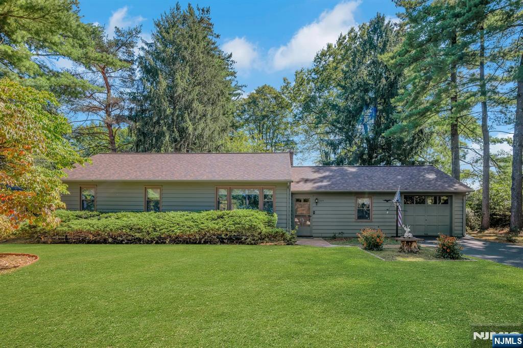 Welcome to 1105 Knoll Road, a charming 3-bedroom, 1 1/2 bath home set in the desirable Knoll neighborhood of Parsippany. This warm and inviting residence offers a perfect blend of comfort and functionality, making it an ideal place to call home. Step inside to find a spacious layout highlighted by a cozy three-season room, perfect for relaxing with morning coffee or enjoying the change of seasons. The home features three well-proportioned bedrooms and 1 baths, providing plenty of space for everyday living. Outdoors, you'll fall in love with the lovely backyard a private retreat for gatherings, gardening, or simply unwinding after a long day. Conveniently located near schools, shopping, dining, and major highways, this home offers both tranquility and accessibility. Don't miss your opportunity to make this Knoll Road gem your own!