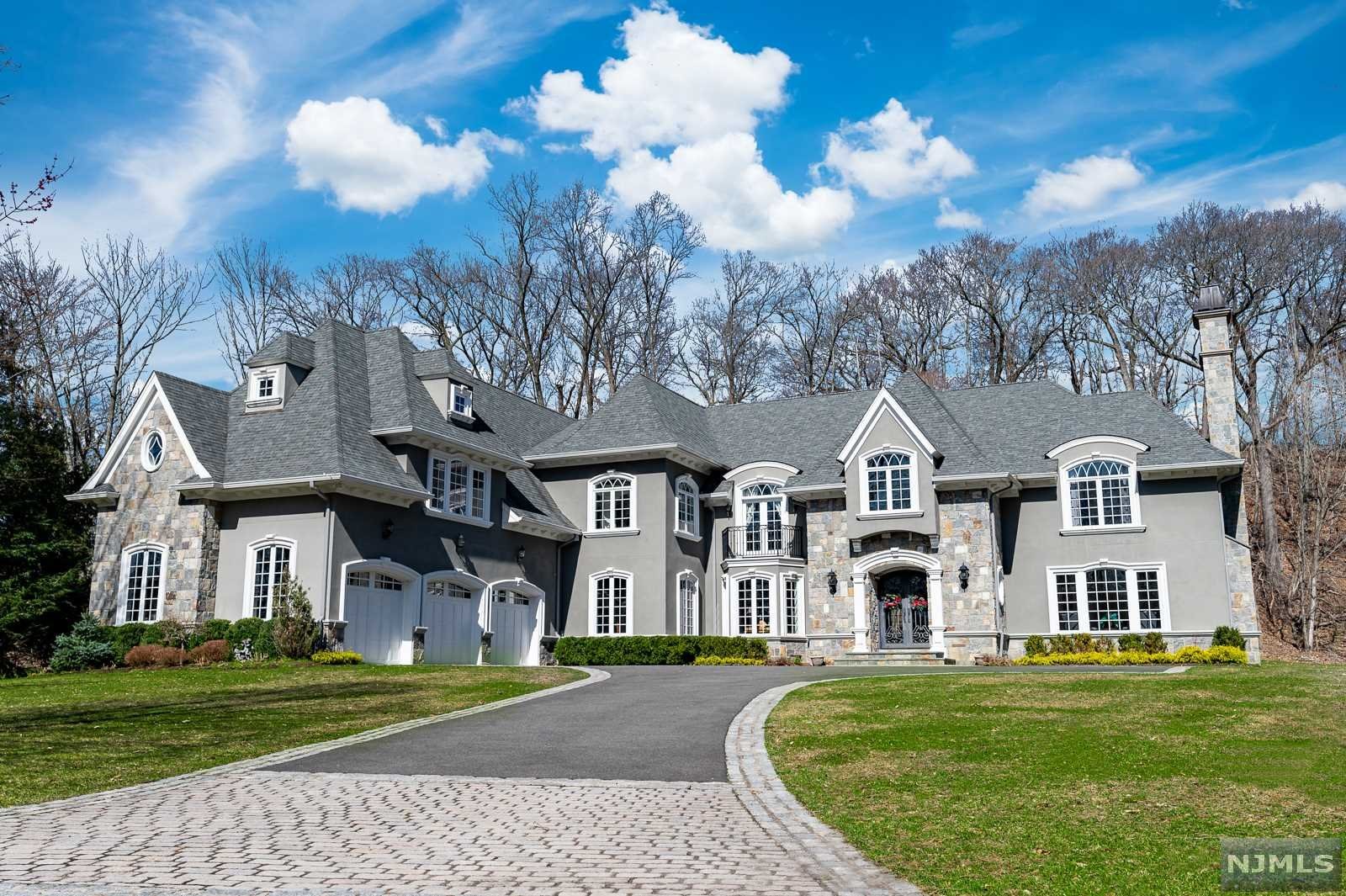 Renowned Builder's Own Private Residence which was completely custom built only 6 years ago. A palatial French Manor with 7,400+ sq ft of living space, sitting on nearly 1.5 acres. Enter into a dramatic entrance foyer with a grand staircase, continue along to perfectly appointed formal living and dining rooms. The kitchen is a chef's delight, featuring professional grade appliances, designer cabinetry, and a massive center island. The kitchen is open-concept and sits beside a two-story family room with soaring windows and a full wet-bar. Upstairs you with find 4 generously sized bedrooms, 3 more full bathrooms, and master wing fully equipped with dual closets and a spa-like master bathroom. Upgrades galore, including 6zone central air, home security, a home library, 4 machine laundry, and so much more.. The grounds are lush and green, with plenty of room for a pool. Sitting at the end of a quiet cul-de-sac with lake views, you will never want to leave this luxurious oasis.