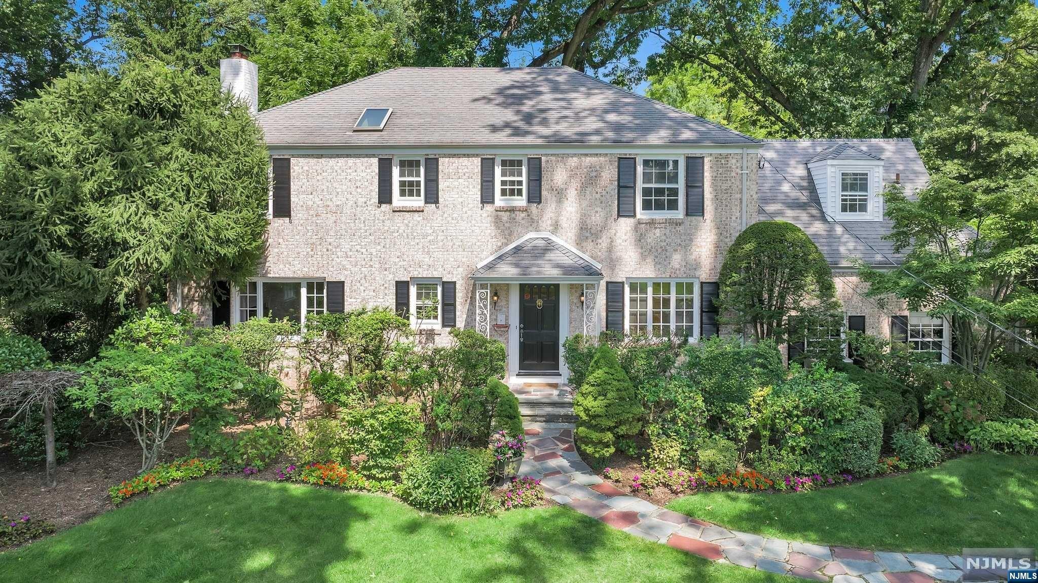 Incredible opportunity to own this magnificent home on Fairmount Rd in Ridgewood's esteemed Willard school district. As you step inside, you'll be greeted by a beautifully crafted curved staircase in the entry hall, setting the tone throughout. The front to back living rm features a fireplace, while the adjacent family rm provides a comfortable space just off the eat-in kitchen w/ convenient mudrm. Entertain in style in the formal dining rm, complete w/ a charming bay window & builtins, then step into the office w/ sliding doors that open to the patio & lush gardens. Recently refinished hardwood floors grace both the 1st & 2nd levels, creating a seamless flow throughout. The 2nd story boasts 5 bedrooms & 3 full baths, including a luxurious primary BR suite w/ a sitting rm, Juliet balconies, fireplace, dressing area & an ensuite BA. The LL is finished w/ tile flooring, laundry rm, a half bathroom & a recreation rm. Don't miss the opportunity to call this majestic home your own!
