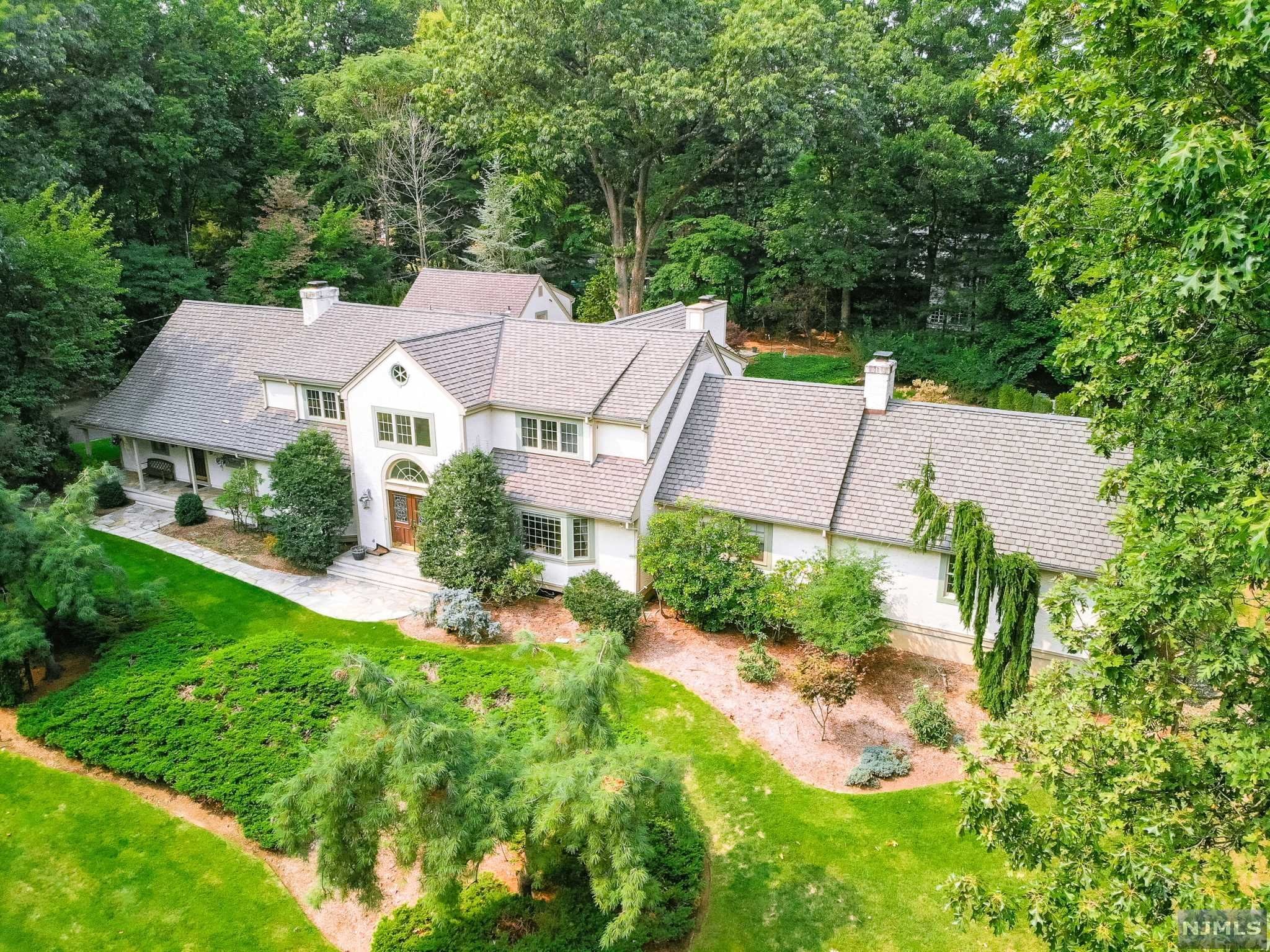Urban Farms/beautiful South Gate setting! This custom blt home of nearly 6300 sq ft sits on a private, lavishly landscaped acre property w/Pugliese gunite pool w/ waterfall. Two story entry foyer, Grt Rm w/vaulted ceiling/fpl/wet bar & access to stone patio & deck. Updated kitchen w/granite counters & stainless steel appliances. Family rm w/brick fpl. Fabulous master suite w/sitting rm/, luxury bath, exercise rm w/fpl, built-ins & French doors to private deck. 3/4 additional bed rooms & three newer baths on the 2nd floor. 4-5 car heated garage leading to separate apartment ideal for guests. Full finished bsmt w/rec rm/bar, train room, & storage rm. Camera & media security system. Furniture included in sale.
